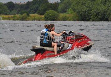 Jet ski driver and passenger Jet ski driver and passenger